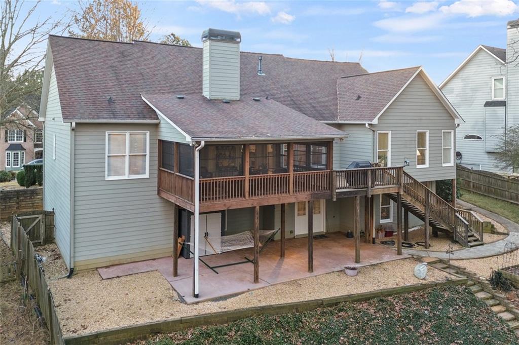 352 Woodbrook Crest Canton, GA 30114 - Photo 42 of 53 a view of a house with wooden deck and furniture