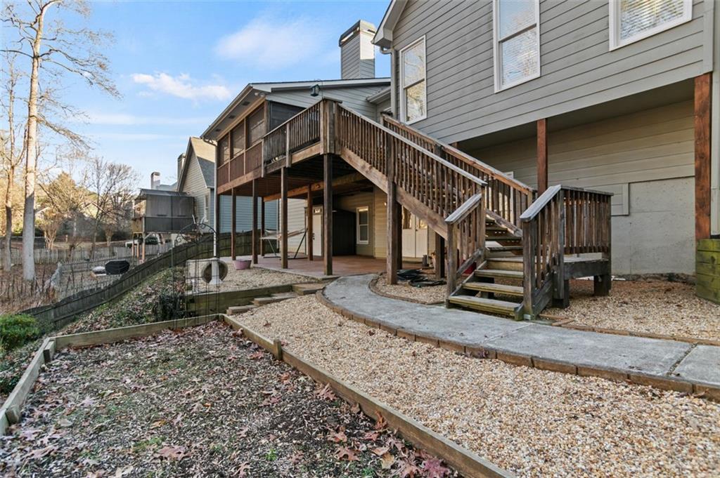 352 Woodbrook Crest Canton, GA 30114 - Photo 48 of 53 a view of a house with a small yard and wooden stairs
