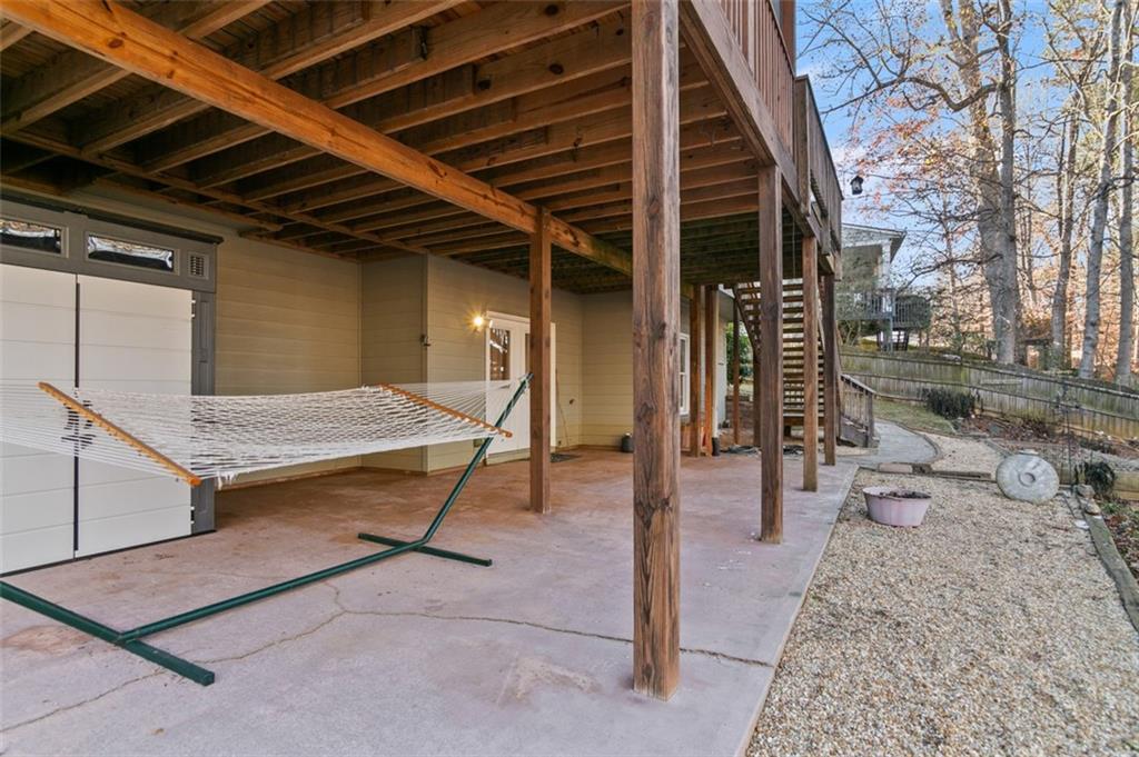 352 Woodbrook Crest Canton, GA 30114 - Photo 49 of 53 a view of a porch with a table and chairs