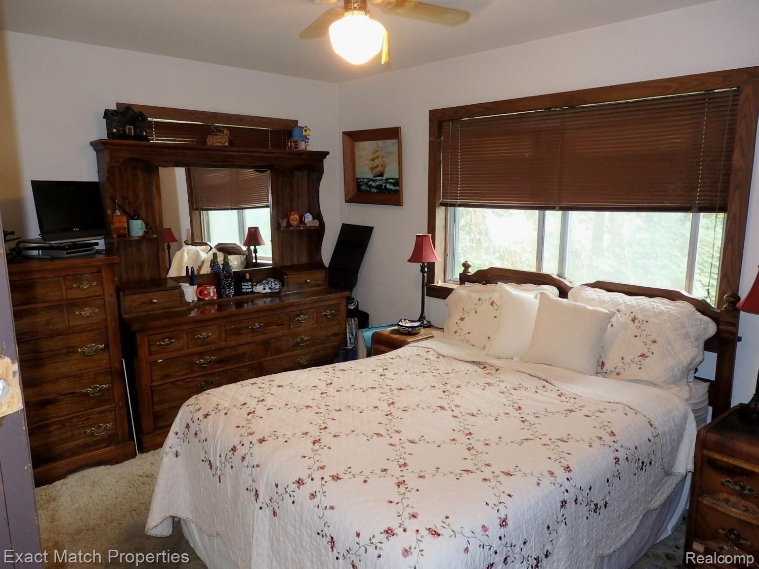 1392 Delta Road Walled Lake, MI 48390 - Photo 32 of 48 Master bedroom with ceiling fan