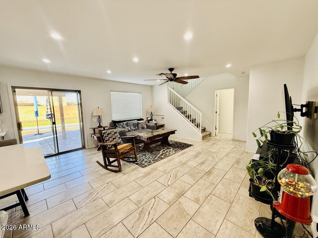 16246 West Boca Raton Road Surprise, AZ 85379 - Photo 12 of 27 a living room with furniture and a wooden floor
