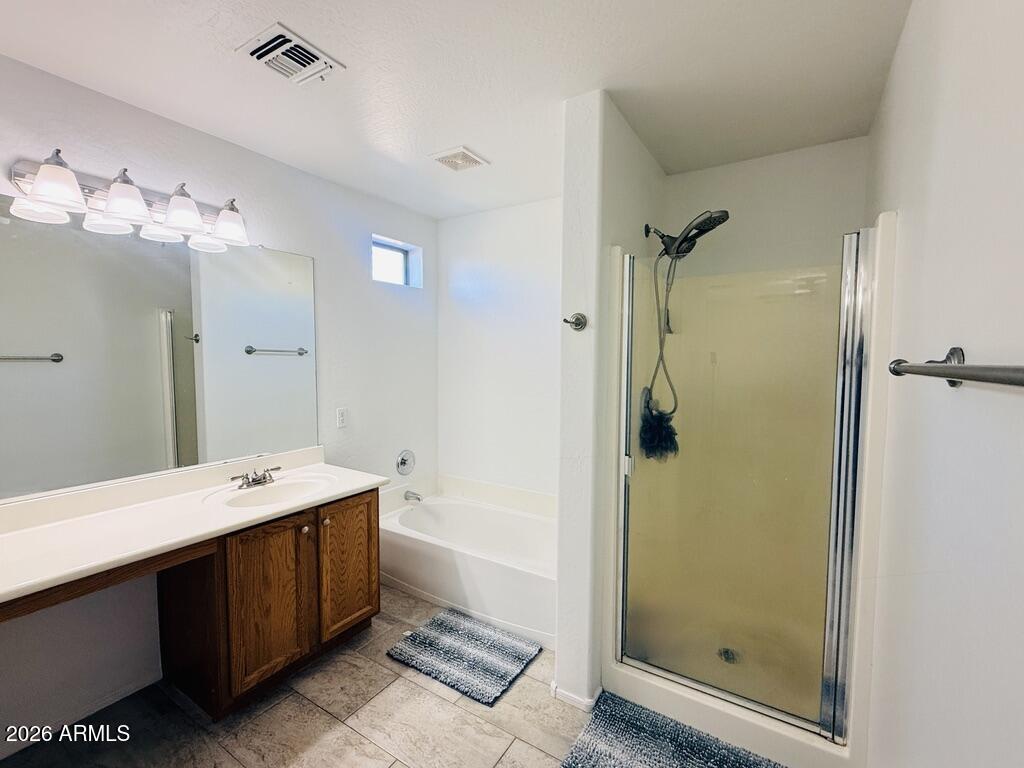16246 West Boca Raton Road Surprise, AZ 85379 - Photo 19 of 27 a bathroom with a double vanity sink mirror and shower