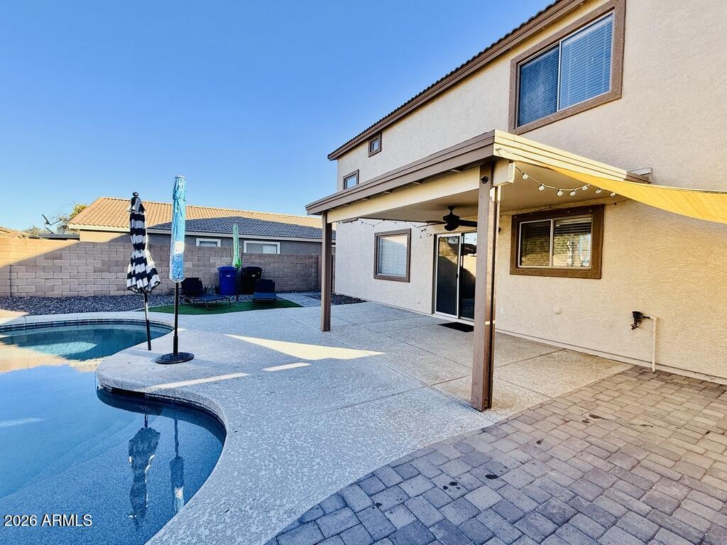16246 West Boca Raton Road Surprise, AZ 85379 - Photo 25 of 27 a swimming pool with outdoor seating and yard