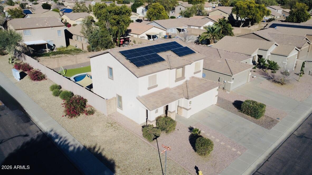 16246 West Boca Raton Road Surprise, AZ 85379 - Photo 5 of 27 an aerial view of a house with a yard