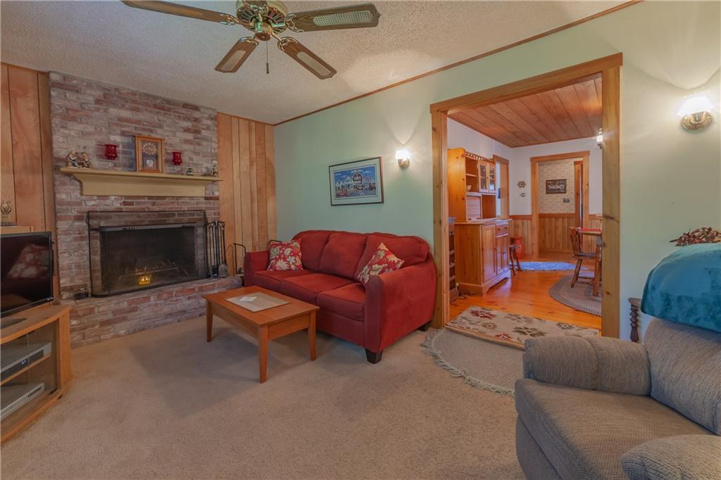 135 Lobster Cove Road Boothbay Harbor, ME 04538 - Photo 9 of 21 The living room with brick fireplace...