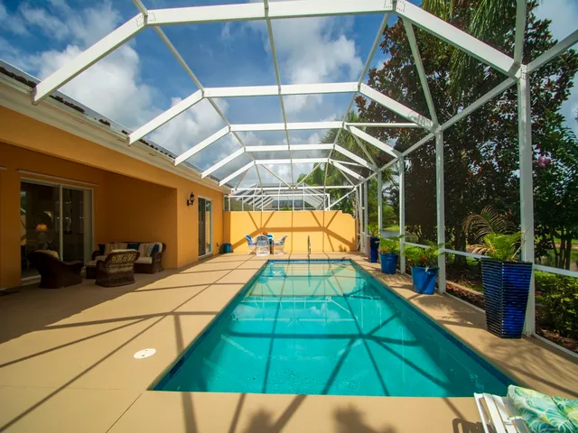 a view of a swimming pool with a patio