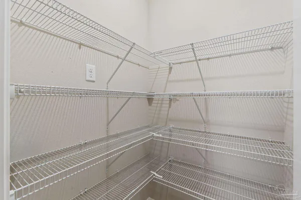 a view of a room with racks on the wall