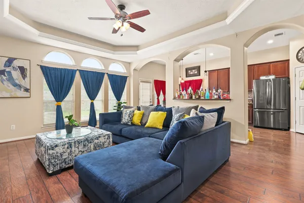 a living room with furniture fireplace and flat screen tv