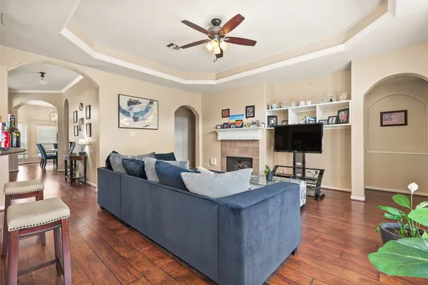 a living room with furniture and a flat screen tv