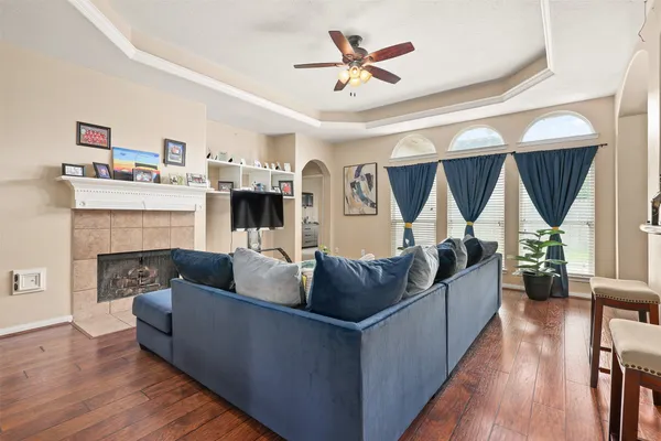 a living room with furniture and a fireplace