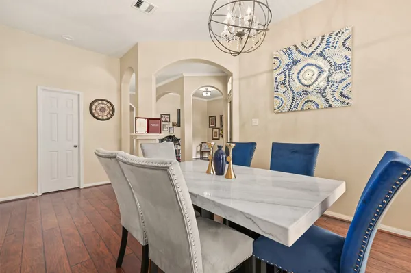 a view of a dining room with furniture and wooden floor