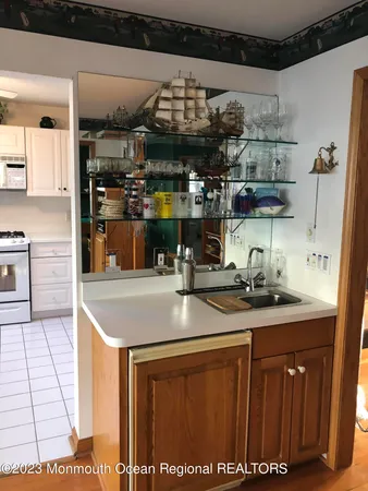 a kitchen with stainless steel appliances granite countertop a sink and cabinets
