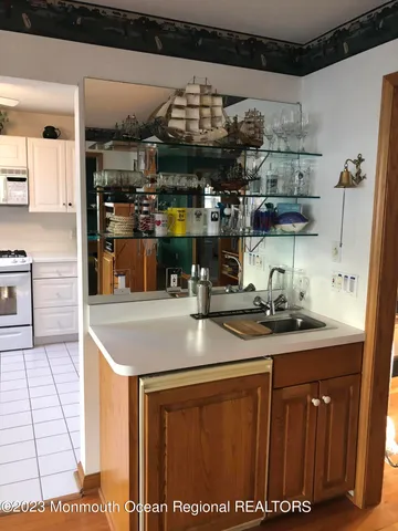 a kitchen with stainless steel appliances granite countertop a sink and cabinets