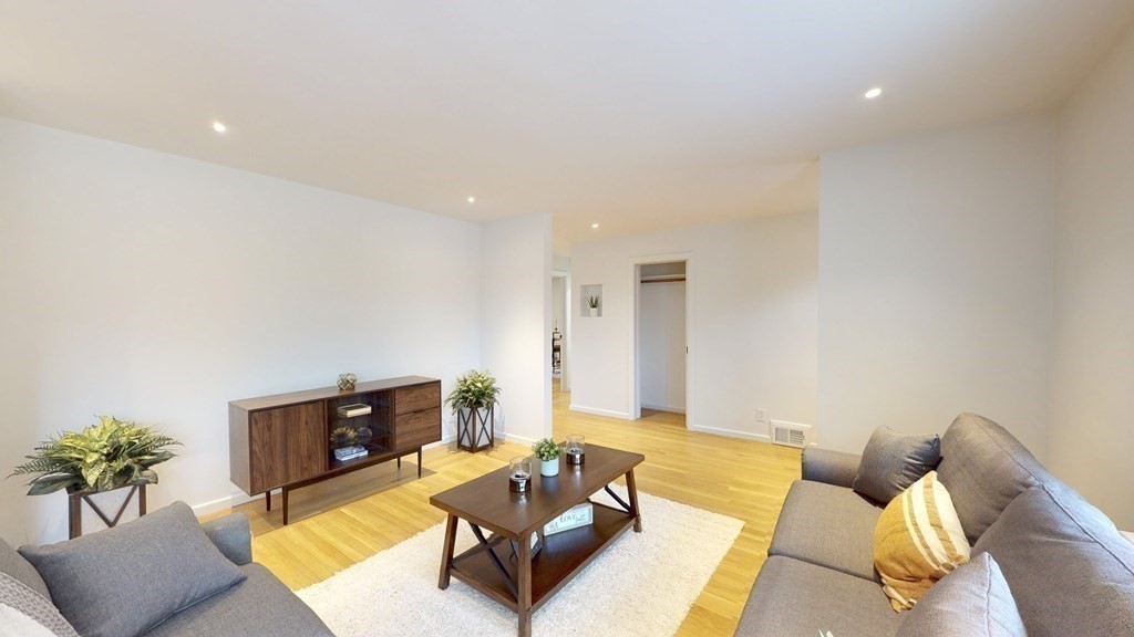 4 Sunset Drive Walpole, MA 02081 - Photo 11 of 37 a living room with furniture and a couch