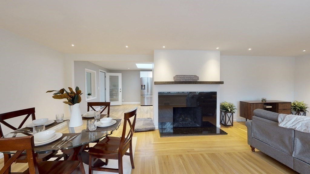 4 Sunset Drive Walpole, MA 02081 - Photo 12 of 37 a living room with furniture and a fireplace