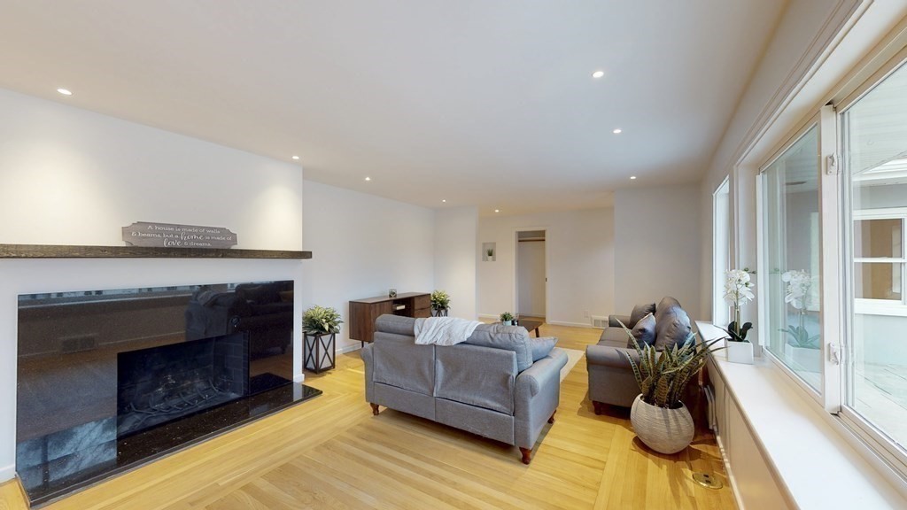 4 Sunset Drive Walpole, MA 02081 - Photo 13 of 37 a living room with furniture and a fireplace