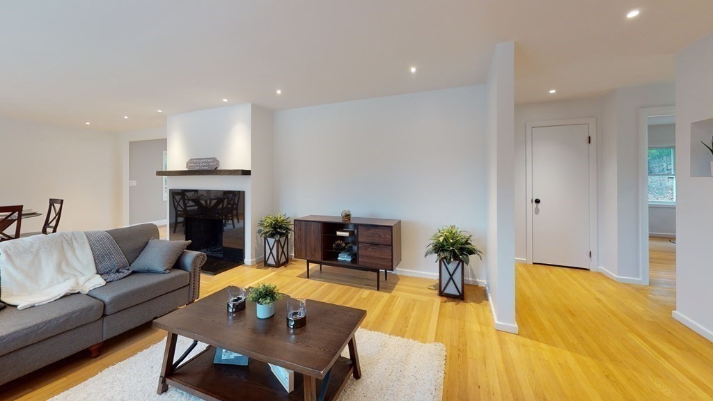 4 Sunset Drive Walpole, MA 02081 - Photo 14 of 37 a living room with furniture and a fireplace
