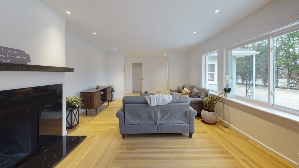 4 Sunset Drive Walpole, MA 02081 - Photo 15 of 37 a living room with furniture and a fireplace
