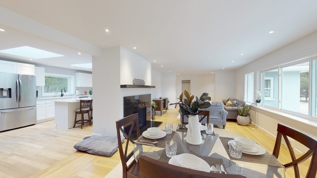 4 Sunset Drive Walpole, MA 02081 - Photo 17 of 37 a dining room with furniture a wooden floor and kitchen view
