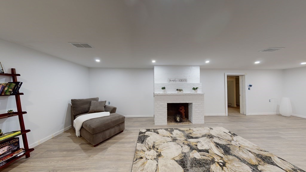 4 Sunset Drive Walpole, MA 02081 - Photo 23 of 37 a living room with furniture and a fireplace