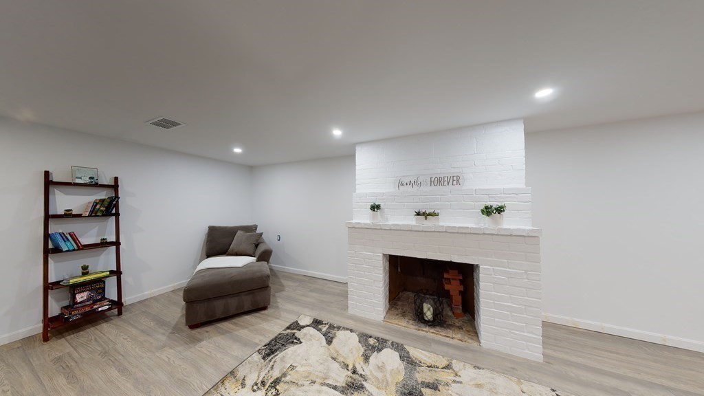 4 Sunset Drive Walpole, MA 02081 - Photo 24 of 37 a living room with furniture and a fireplace