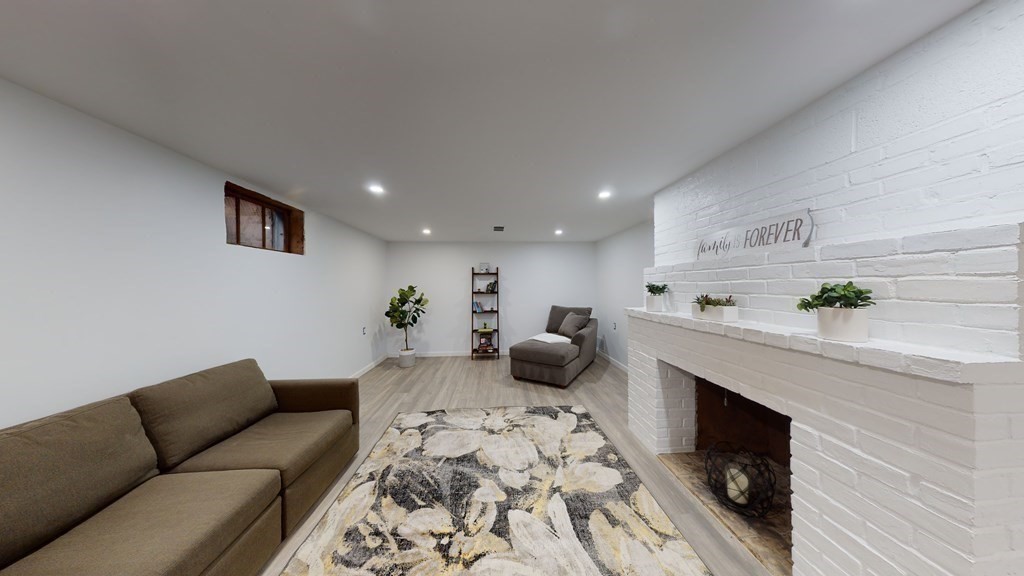 4 Sunset Drive Walpole, MA 02081 - Photo 25 of 37 a living room with furniture and a potted plant