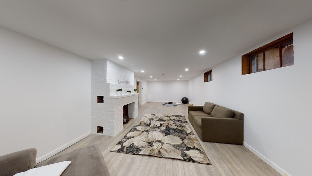 4 Sunset Drive Walpole, MA 02081 - Photo 27 of 37 a bed room with furniture and a flat screen tv