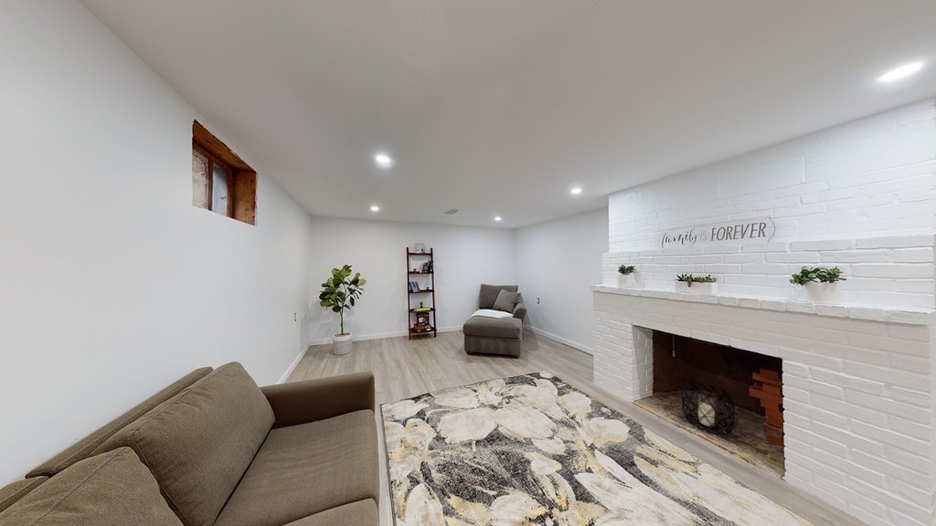 4 Sunset Drive Walpole, MA 02081 - Photo 29 of 37 a living room with furniture and a fireplace