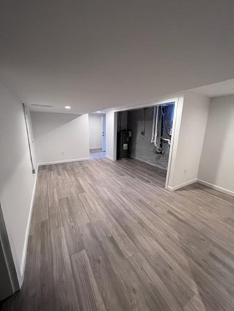 4 Sunset Drive Walpole, MA 02081 - Photo 36 of 37 an empty room with wooden floor and windows