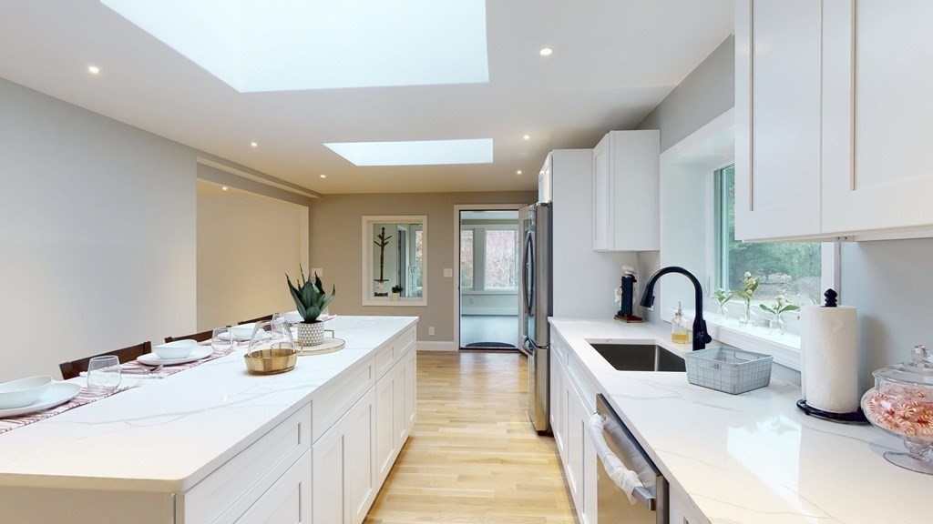 4 Sunset Drive Walpole, MA 02081 - Photo 5 of 37 a kitchen with counter space a sink and appliances