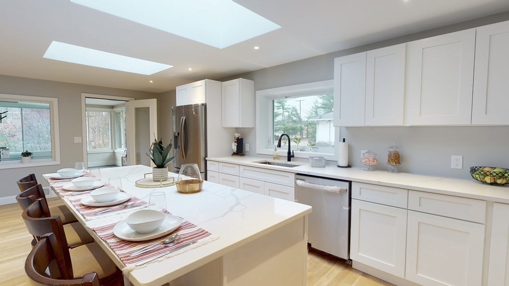 4 Sunset Drive Walpole, MA 02081 - Photo 7 of 37 a kitchen with sink and white cabinets