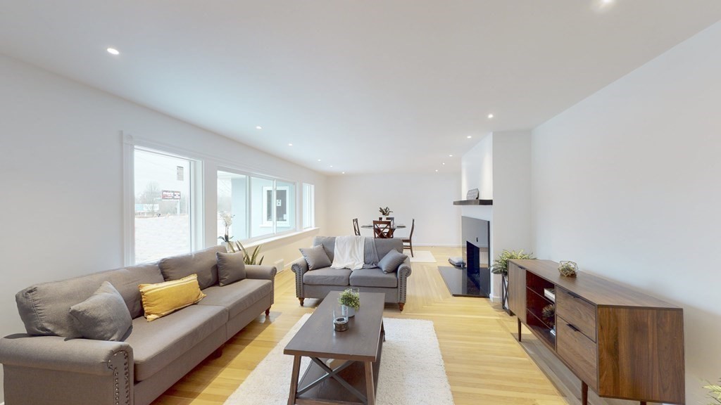 4 Sunset Drive Walpole, MA 02081 - Photo 9 of 37 a living room with furniture and a couch