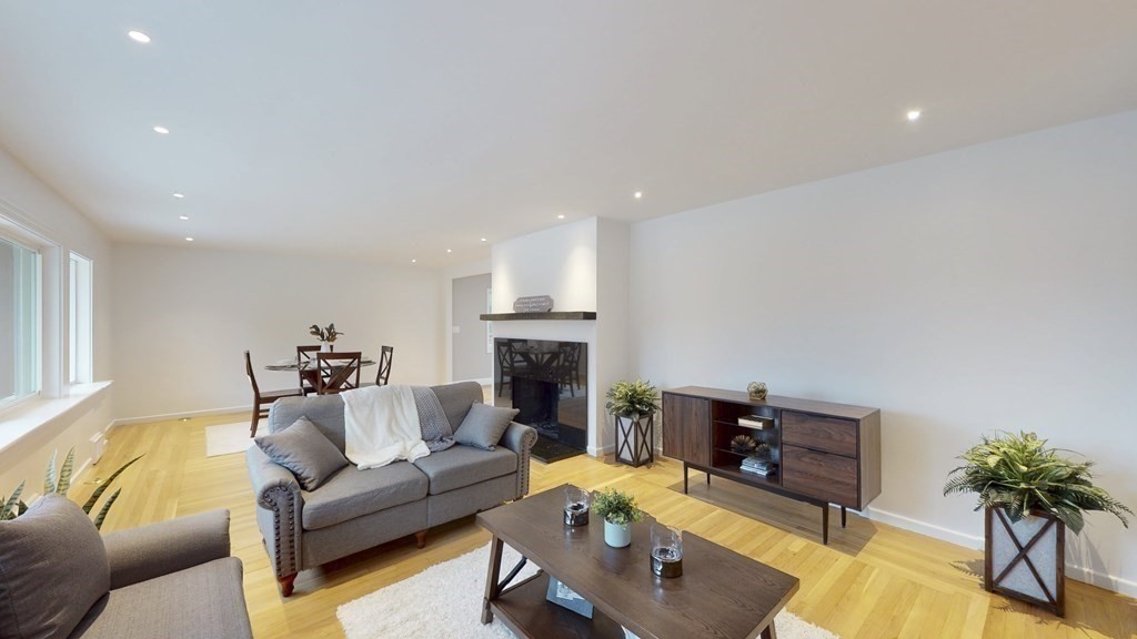 4 Sunset Drive Walpole, MA 02081 - Photo 10 of 37 a living room with furniture and a fireplace