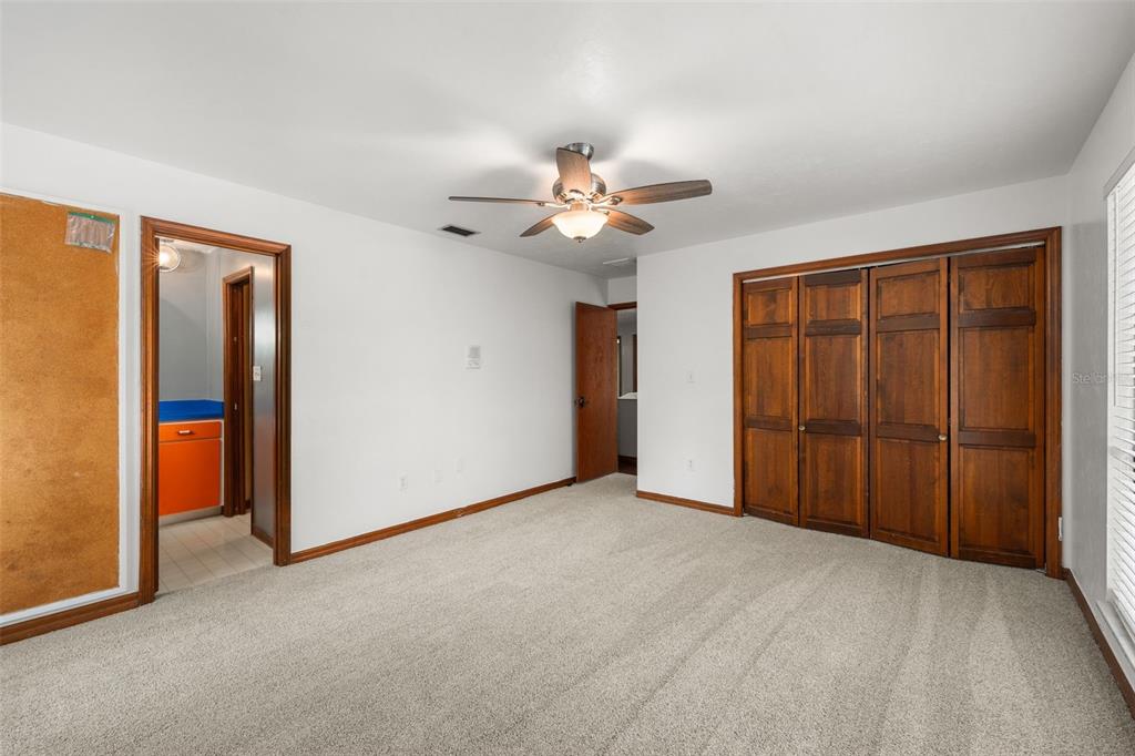 4703 Northwest 124th Street Gainesville, FL 32606 - Photo 39 of 55 a view of a room with a ceiling fan and a chandelier fan