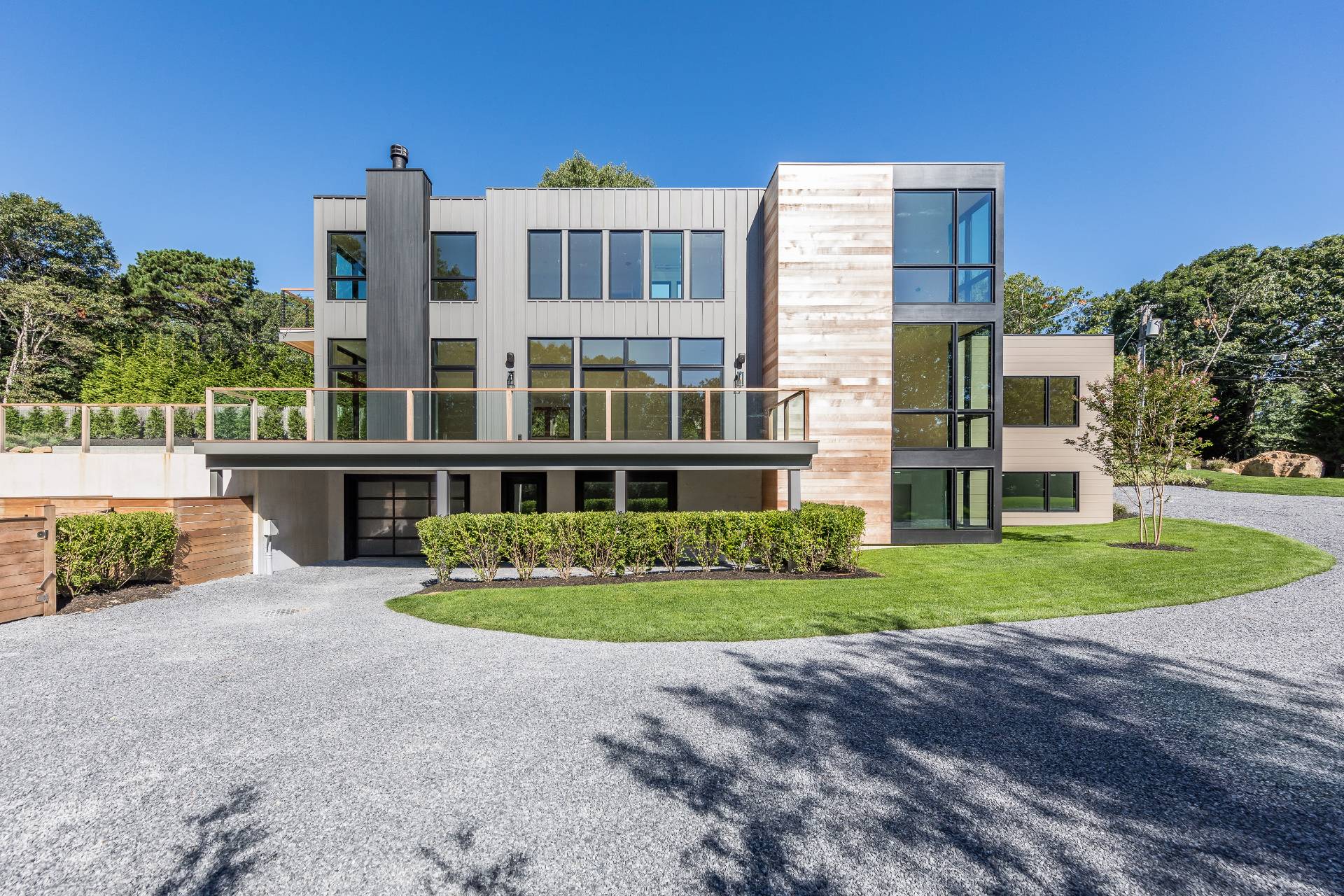 a front view of a residential apartment building with a yard