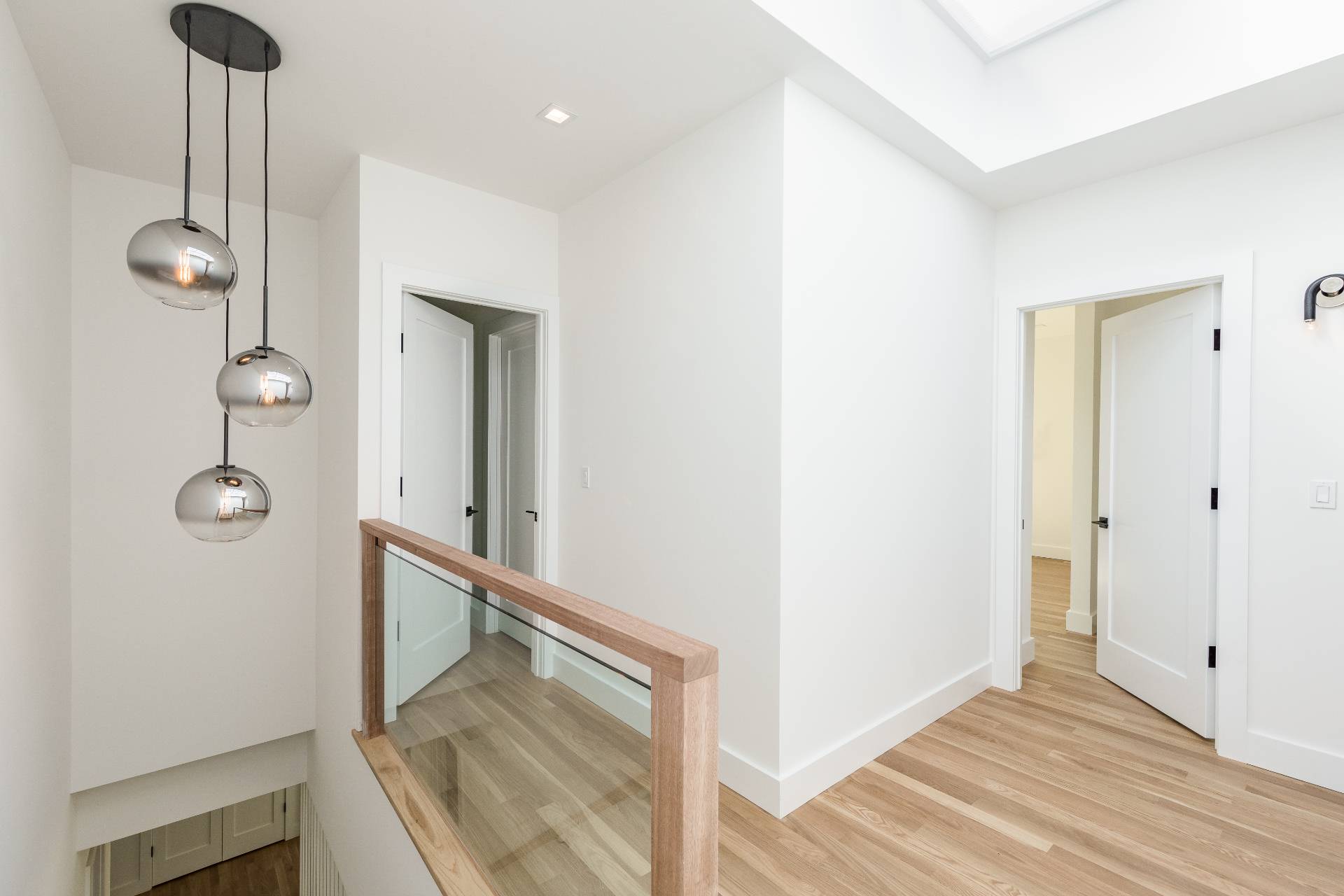 19 Peter's Path East Hampton, NY 11937 - Photo 18 of 29 a view of a hallway with wooden floor and staircase