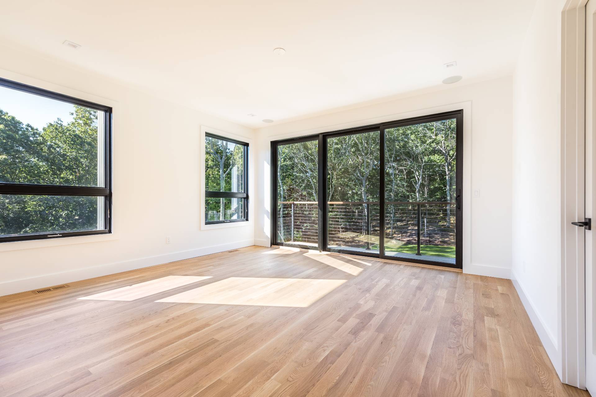 19 Peter's Path East Hampton, NY 11937 - Photo 19 of 29 a view of an empty room with wooden floor and a window