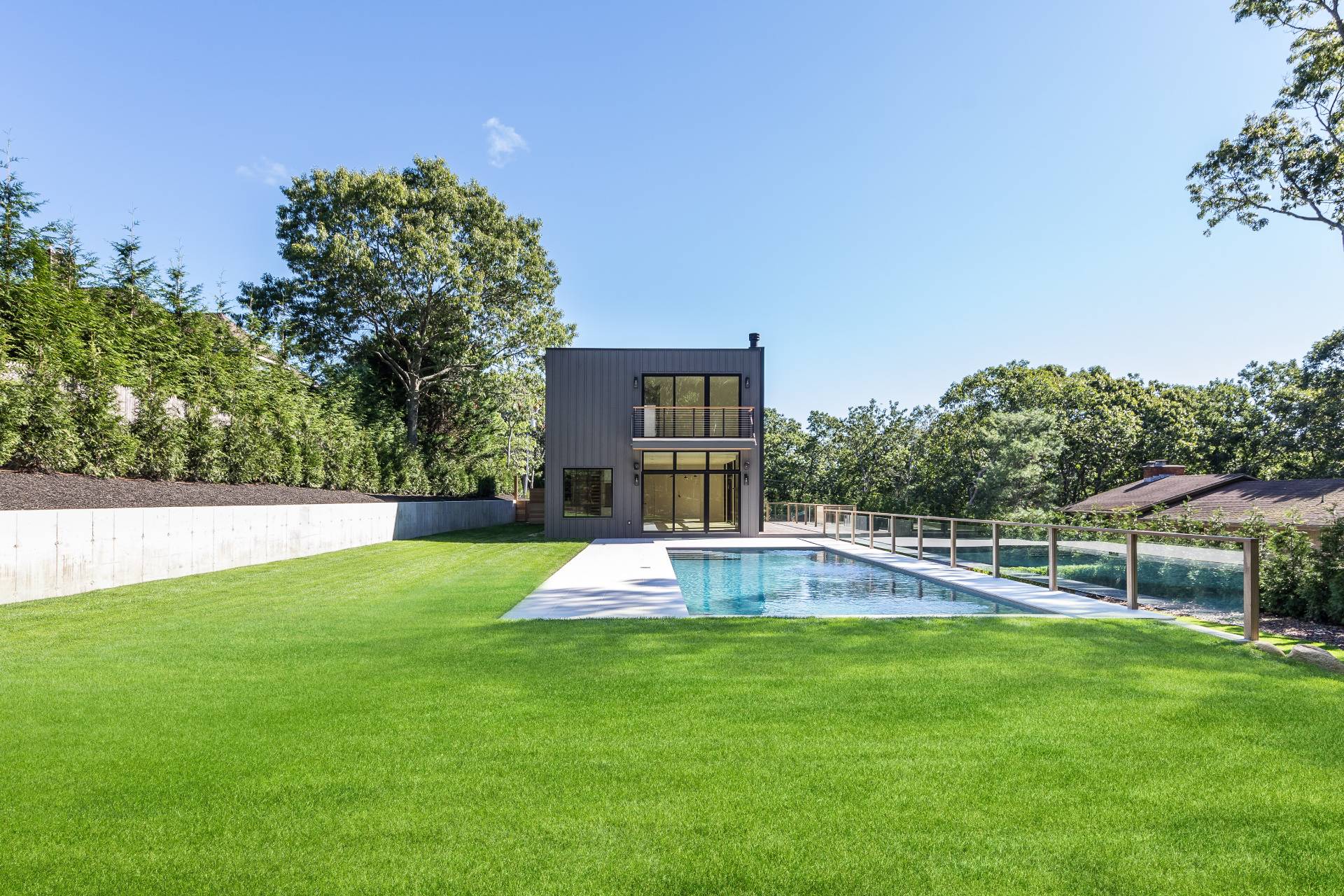19 Peter's Path East Hampton, NY 11937 - Photo 8 of 29 a view of a backyard with a garden and plants