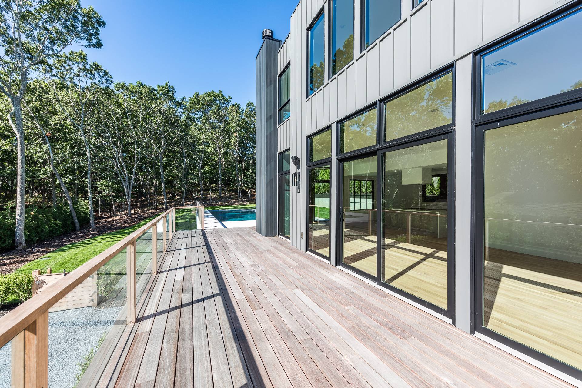 19 Peter's Path East Hampton, NY 11937 - Photo 9 of 29 a view of balcony with couch and wooden floor