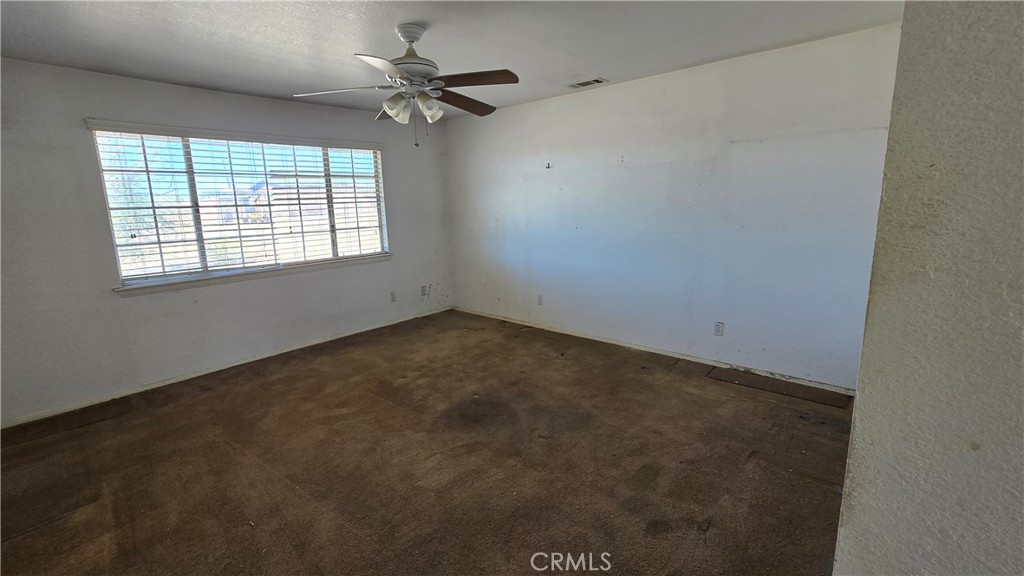 14280 Navajo Road Apple Valley, CA 92307 - Photo 17 of 28 an empty room with a window