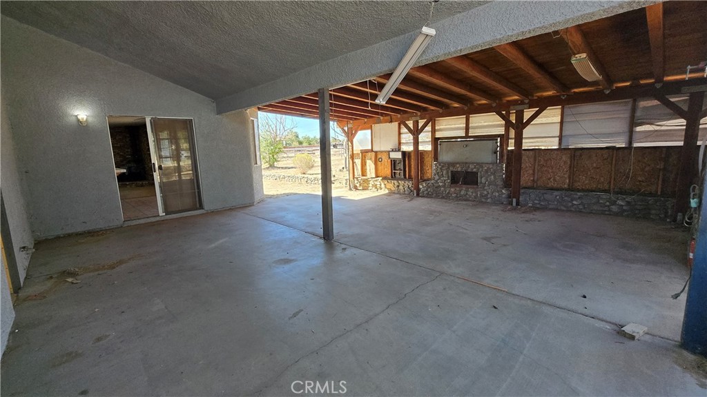 14280 Navajo Road Apple Valley, CA 92307 - Photo 26 of 28 a view of an empty room with a window