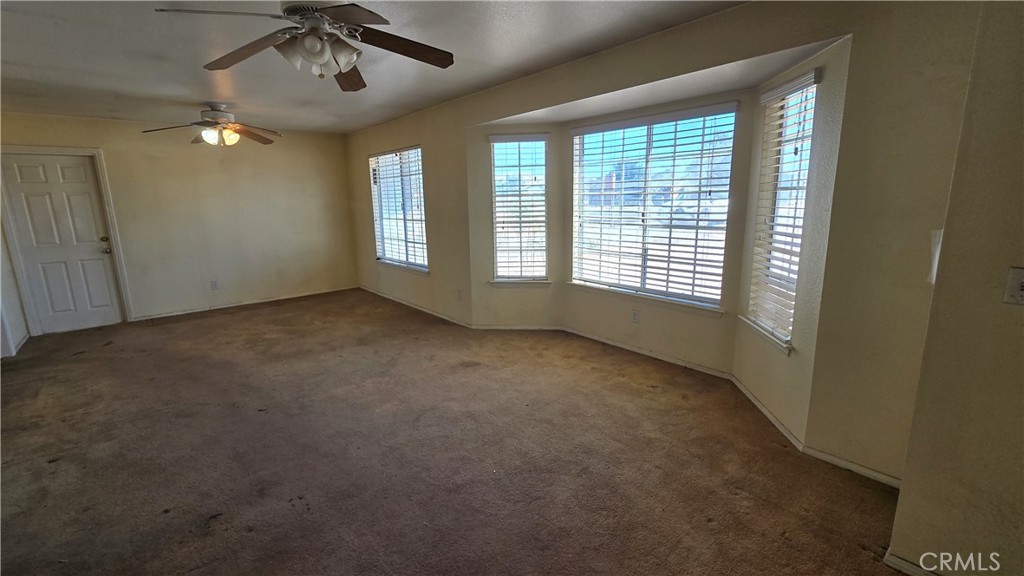 14280 Navajo Road Apple Valley, CA 92307 - Photo 4 of 28 a view of an empty room with a window
