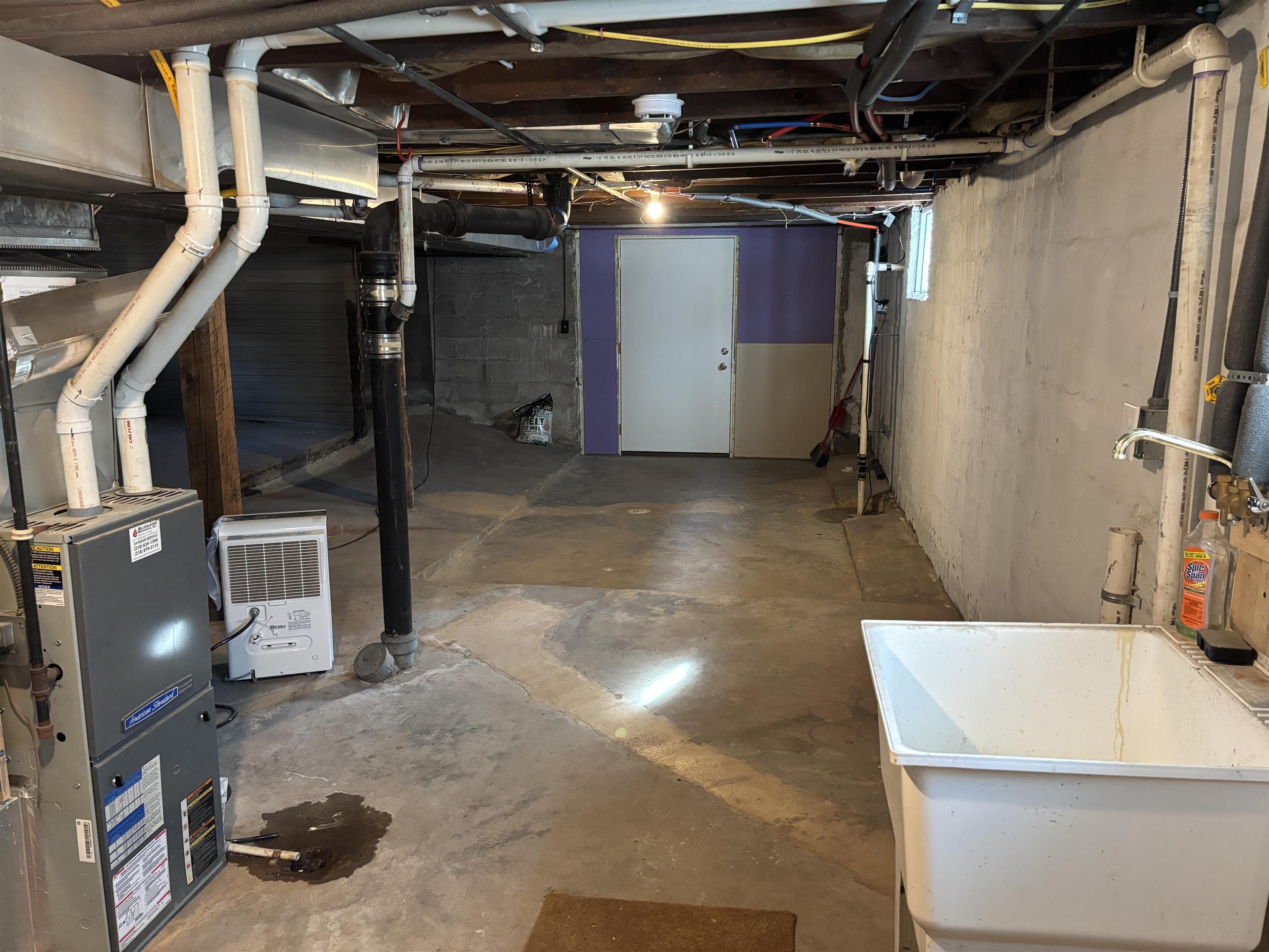 2515 Jefferson Street Duluth, MN 55812 - Photo 23 of 25 Unfinished below grade area with a sink and heating unit