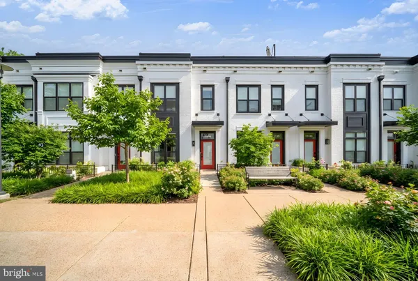 a front view of a brick house with a yard