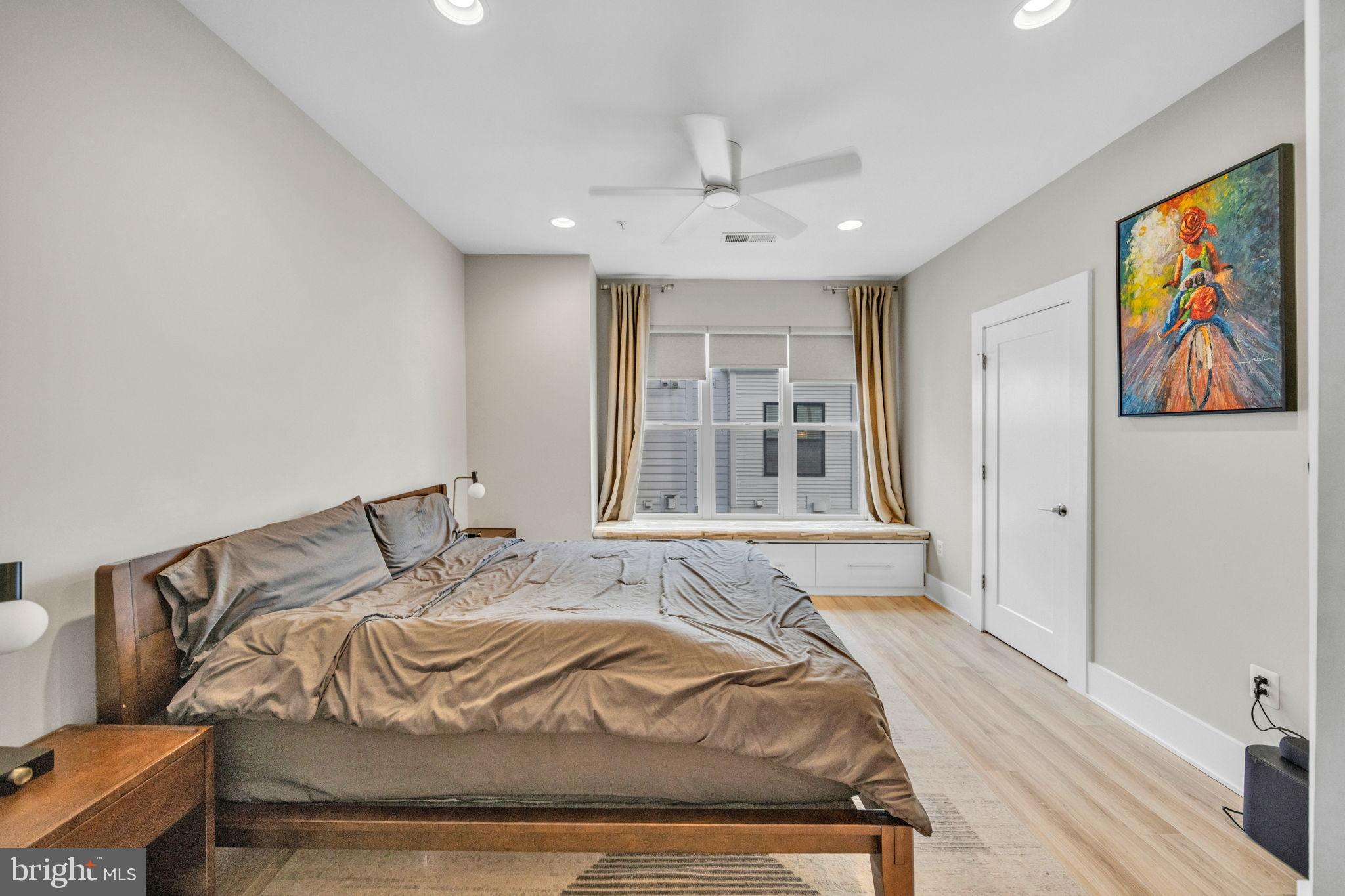 11326 Emerald Park Road Potomac, MD 20854 - Photo 11 of 40 a bedroom with bed and painting on the wall