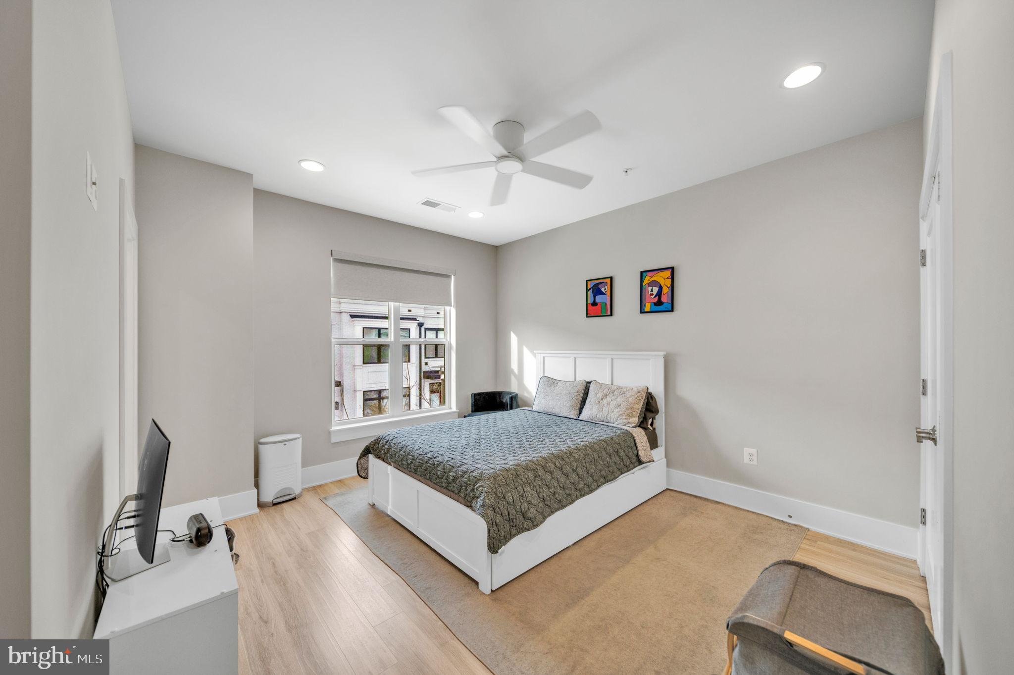 11326 Emerald Park Road Potomac, MD 20854 - Photo 15 of 40 a bedroom with a bed and window