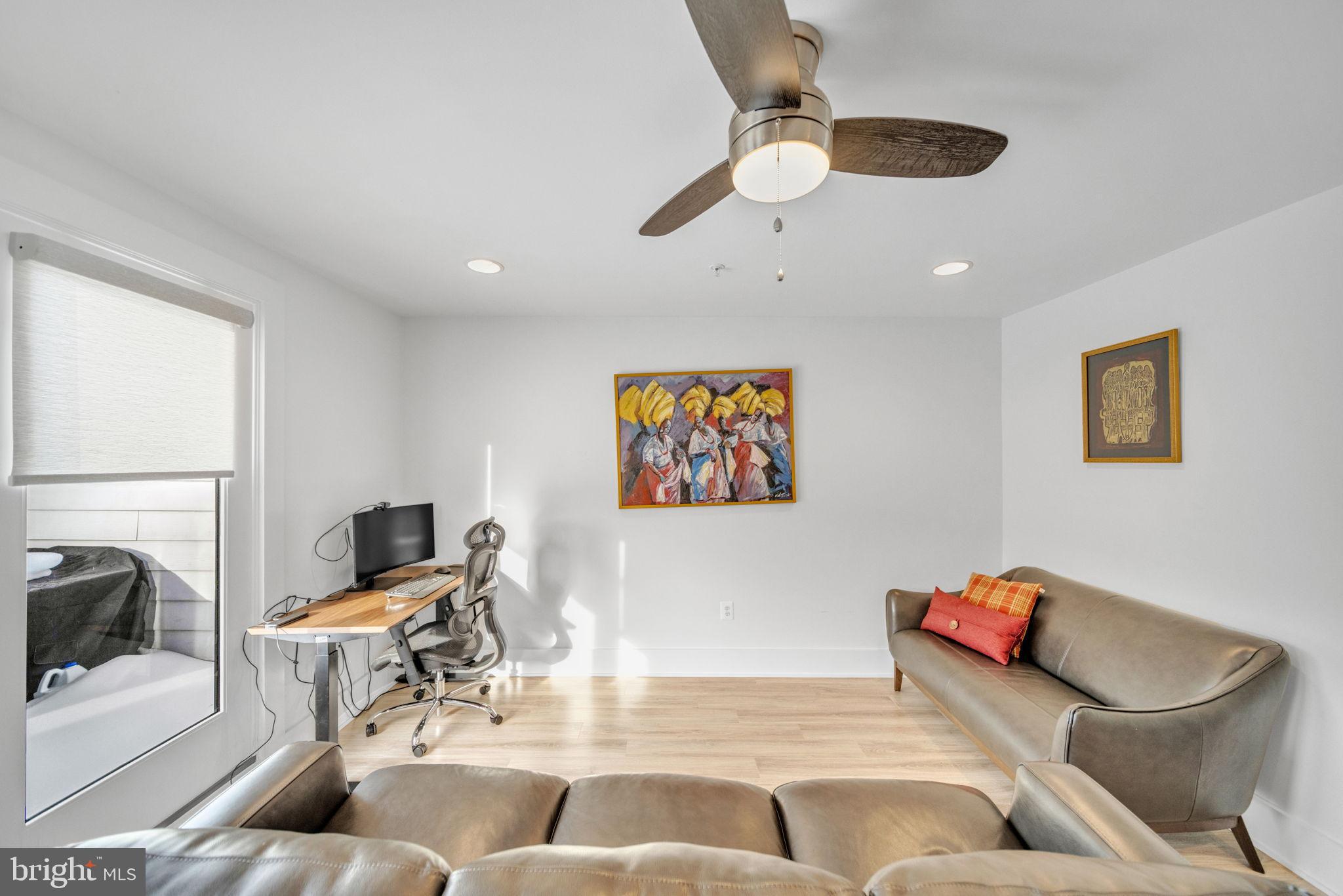 11326 Emerald Park Road Potomac, MD 20854 - Photo 22 of 40 a living room with furniture and a flat screen tv