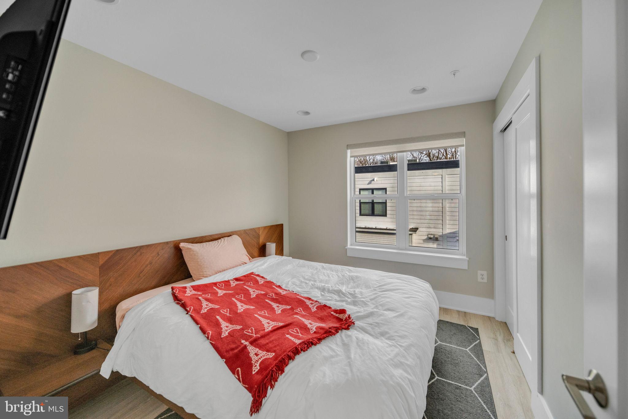 11326 Emerald Park Road Potomac, MD 20854 - Photo 24 of 40 a bedroom with a bed and window