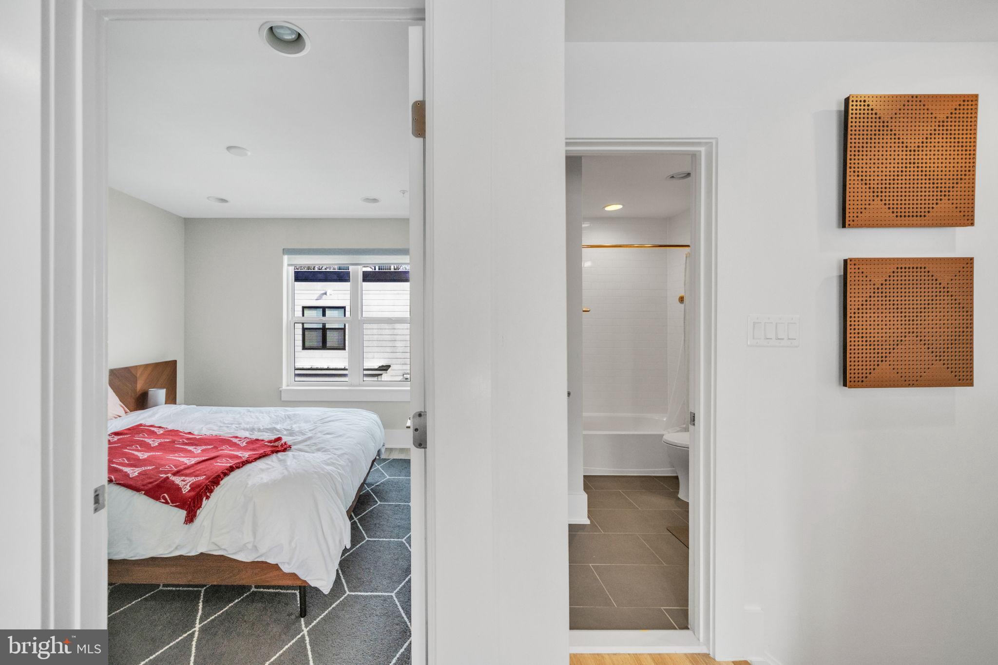 11326 Emerald Park Road Potomac, MD 20854 - Photo 25 of 40 a bedroom with a bed and a window