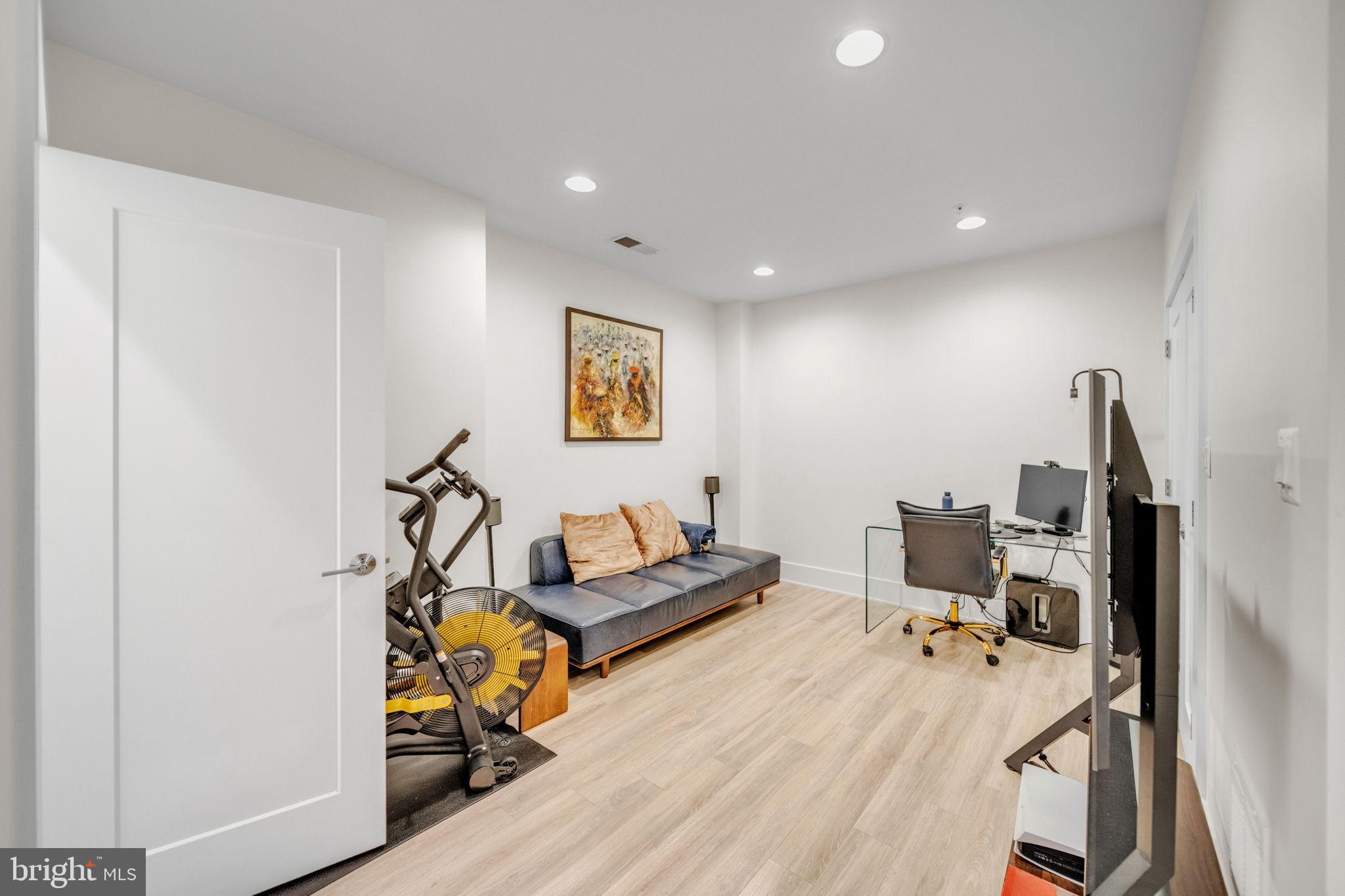 11326 Emerald Park Road Potomac, MD 20854 - Photo 29 of 40 a living room with furniture and a flat screen tv
